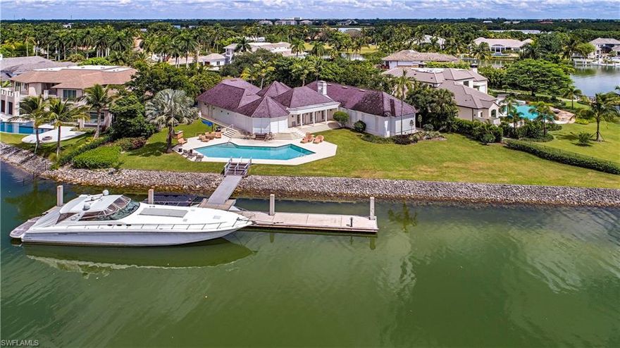 Rare 238 ft of water frontage on a quiet cul-de sac.  Designed by Kasimir Korybut this unique, comfortable home is move in ready. This home has a open floor plan, high ceilings, and nearly every room offers a water view. Renovated kitchen and baths.  The 100' concrete floating dock, is positioned to the side to not block the long wide waterviews.  4 bedrooms, 5.5 baths  Port Royal Club Membership Eligibility