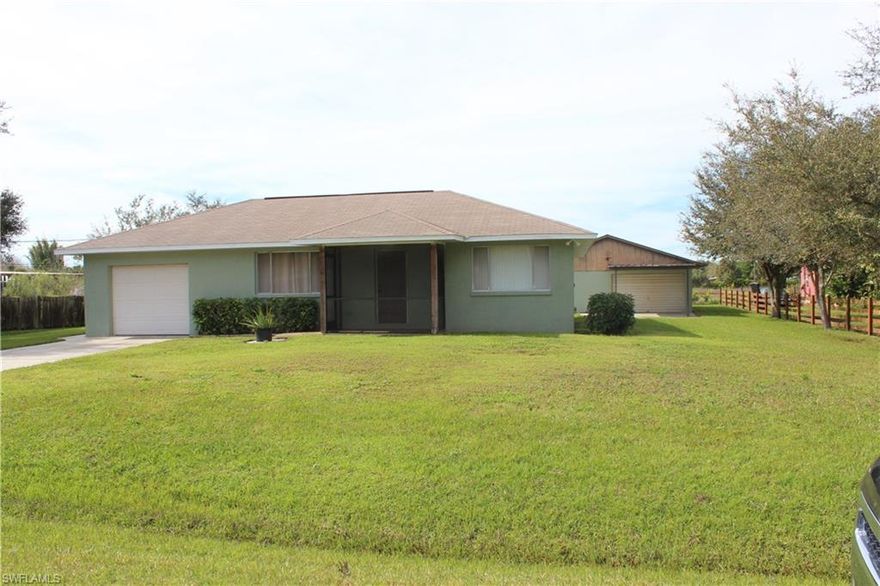 Well maintained 2 Bed 2 Bath concrete block home located on almost a half acre with a 900 sq. ft. concrete block detached garage with 220 electric. Superb location off Orange River and Buckingham Rd. Community boat ramp via the Orange River at the end of Shady River Ln.  Nice private location backing up to a plant nursery. Home has been well maintained and features a newer roof in 2004. Rare opportunity to own a home on this beautiful street.