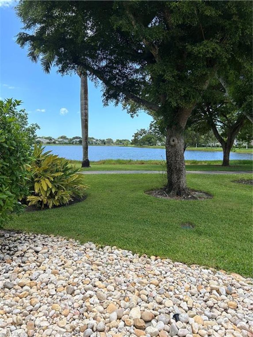 The best location in Camelot! Make this sweet little condo your own, motivated seller, owner financing available! Dream home or investment property, picture yourself living in paradise, steps away from the pool and a tranquil lake view! Private courtyard to relax and entertain.  Screened area with slider and lake view was used as a second bedroom but buyer has option to open it up. AC unit, LVP flooring and refrigerator all replaced in 2023, water heater 2021. Under cover parking for 1 car with storage locker, also a second storage locker and gated bike storage adjacent to front door. If walking, running or biking are your thing there is a peaceful, scenic trail around the 33 acre lake. The most desirable location in Camelot, not only is it right on the lake but also right next to the pool, just step of of your front door and you’re there, perfect for a quick dip in the pool or spa. Dry sauna situated in the pool house and car wash facility outside.Tennis and Pickleball courts are also available. It’s a short walk/bike ride to Kings lake shopping plaza with Publix, Starbucks, restaurants, breakfast, ice cream and hair salon, can be accessed from the community without going on to Davis. Minutes away from Naples beaches, Old Naples downtown shops and restaurants. Also close to Tin city and the upcoming Bayshore area, Botanical gardens and Celebration park. Don’t sleep on this one, schedule your showing today.