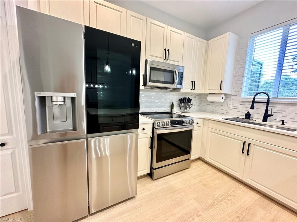 Photo of 10190 Tin Maple DR #128, ESTERO, FL 33928 (MLS # 226005045)