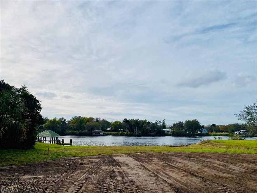 Immerse yourself in the breathtaking beauty of this prime property along the Caloosahatchee River, boasting an exquisite location beyond the flood
zone. This expansive lot, comprising almost 2 acres (1.5+/- acre home site with an additional 1/3 acre in Corps Rwy property, resulting in a total
yard size of almost 2 acres+/-), features an upscale riverfront slope and a prepped house pad, ensuring both convenience and savings. Key
Features: Strategic Location: Enjoy the convenience of excellent directions to the Gulf of Mexico and the Atlantic, unlocking limitless possibilities for
exploration. Exclusive Sloping Riverfront: Delight in the natural slope leading towards the river, complemented by a carefully crafted private beach
section, providing an idyllic waterfront escape. Ready-Made House Pad: Benefit from a prepped house pad, offering a seamless foundation for the
construction of your dream home. Liberty in Lifestyle: Experience the freedom to park your RVs, keep your boat in your yard, and more, without
any restrictions. Seize the opportunity to own this extraordinary riverfront parcel with a dedicated private beach section. Elevate your lifestyle with
unparalleled potential for a waterfront living experience. Note: This property stands out as a rare gem along the Caloosahatchee River.