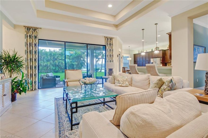 AMAZING HOME!!!!!! Now is your opportunity to get into this beautiful Biltmore Style home in Riverstone. As soon as you walk in you are greeted to a central great room with 14' ceilings. A spacious kitchen with ample cabinets, 3 large pantries, and central island. Plenty of counter top space, a breakfast bar, and stainless steel appliances. Four bedrooms, and 3 full baths. The master suite giving you separate sinks, and his/her closets. Impact windows, plantation shutters, tile throughout the house, and wood flooring in the bedrooms are just some of the features this beautiful home provides to you. This community also features resort style clubhouse with a fitness room, game room, catering kitchen, 5 tennis courts, a pickle ball court, and poolside bar and cabanas.