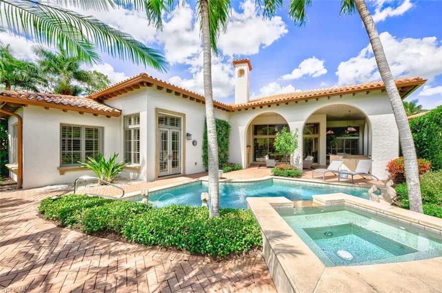 IMMEDIATE GOLF MEMBERSHIP AVAILABLE! Nestled in the serene Noble Heron neighborhood, this exquisite former Alamanda Model home with 3 bedrooms plus a study, 3.5 bathrooms, and a location at the end of a quiet cul-de-sac, this property offers unparalleled privacy and elegance. The home welcomes you with a private paver courtyard, featuring a rotunda, a fountain and a mahogany entry door. The outdoor living space is an oasis, boasting a covered loggia with a fully equipped summer kitchen, a custom-designed pool and spa with a cascading waterfall, and a cozy outdoor gathering area complete with a gas fireplace. Inside, the residence unfolds into an open and spacious living area with soaring ceilings ranging from 11'-14', Saturnia stone flooring, and antique wood beams in the great room. The formal dining room is complemented by a built-in china hutch and butler's pantry, while the state-of-the-art gourmet kitchen caters to culinary excellence. The luxurious master suite features a private vestibule entry, a convenient morning bar, and a sitting area, creating a private retreat within this magnificent home. The property has seen a series of enhancements starting in 2010, with significant remodeling undertaken in 2016-2017, including:

- Enhanced landscaping and extended brickwork.
- Installation of leaders, gutters, and high-efficiency lighting throughout.
- Interior customization with built-ins and high-end finishes.
- Master suite upgrades with new flooring, and a remodeled kitchen featuring new appliances, counters, and lighting.
- Updated technology with a Lutron WIFI lighting system, a new 7.1 sound system, and powered shades for optimal TV viewing.
- System upgrades including new air conditioners, a hot water heater, and a water treatment system.
- Eco-friendly additions such as a tankless pool hot water system and electrical lines for electric vehicles.
- Comprehensive interior refresh with new furniture, paint, flooring, and custom closet designs.

This Noble Heron home is not just a residence; it's a lifestyle, offering luxurious living with thoughtful improvements and custom finishes throughout. With the option of becoming a member of Grey Oaks Country Club you will have 54 holes of golf, newly renovated wellness center, lagoon style pool, tennis, pickle ball, bocce, restaurants, spa, and extensive amenities at your fingertips. All just minutes from downtown Naples world-class shopping fine dining and white sand beaches.