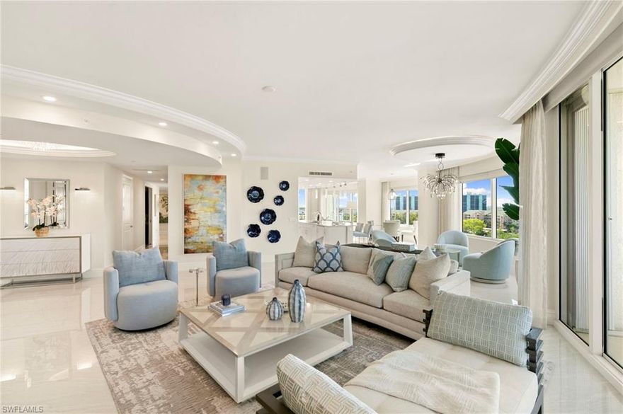 This is a rare opportunity to own a stunning 7th-floor end unit in the exclusive Aqua at Pelican Isle—professionally custom-staged with designer furnishings by Clive Daniel. This custom-curated furniture package is a negotiable option for a fully seamless furnished luxury experience for the next owner.

Spanning 4,171 square feet, this exceptional residence showcases breathtaking panoramic views to the West, South, and East from expansive balconies—capturing both vibrant sunsets and peaceful sunrises. Step off your private elevator into an elegant foyer that immediately sets the tone for the refined design carried throughout.

The thoughtfully designed open floor plan features soaring ceilings with detailed drop accents, grand porcelain and wide-plank tile flooring, and walls of glass that flood the home with natural light. The interiors have been expertly curated by Clive Daniel, blending sophistication and comfort—and offering buyers the unique ability to purchase the designer furnishings exactly as shown for a seamless, move-in-ready lifestyle.

The gourmet kitchen is a true showpiece, complete with top-tier appliances, custom cabinetry, and an oversized island that flows effortlessly into the living and dining spaces—perfect for entertaining in style.

The primary suite is a private retreat with direct balcony access, a spa-inspired bath, and an impressive 16x16 custom walk-in closet with built-in cabinetry and island. Two additional guest suites, each with ensuite baths, plus a versatile den, provide ideal space for hosting family and guests.

Aqua at Pelican Isle delivers an unmatched amenity-rich lifestyle, including a state-of-the-art fitness center, theater, social rooms, library, virtual golf simulator, putting green, fire pits, private marina, and complimentary kayaks. Residents enjoy 24-hour concierge service and access to luxurious guest suites. Pet-friendly, too.

Ideally located in one of Naples’ most coveted waterfront communities, just minutes from world-class dining, shopping, and cultural attractions.

Bonus opportunity: The owner also holds a 50-foot boat slip on site, available for purchase separately.