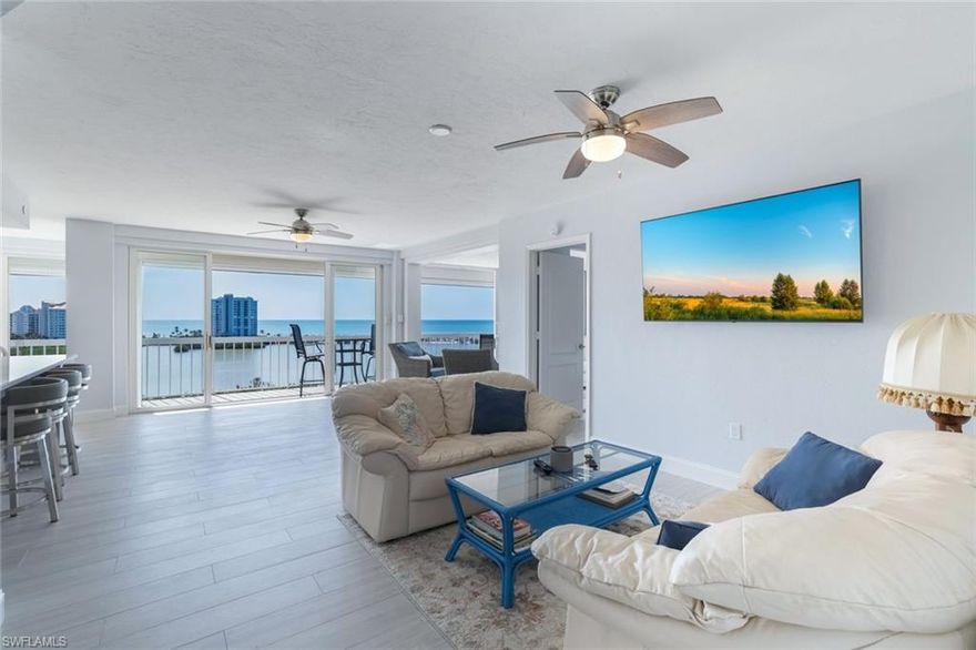 RARELY AVAILABLE unit in St. Tropez, Pelican Bay, with full panoramic views of the Gulf. 04 units do not come on the market often so don't miss your chance to own this stunning end unit renovated in 2022 with attention paid to every detail.  Floor plan was changed to include a breakfast area and sun room with views that will take your breath away. The elevator is only steps away from the front door of 904 that has only had one owner.  This two bedroom two bath unit will fulfill all of your needs for Naples living at it's finest and includes a built in wine cooler in the kitchen.  St. Tropez has a boutique feel since it only has 52 units. The building and lobby have been totally renovated with coastal chic interiors.  There are two guest suites located in the building for your family and friends when they come to visit. There is a walkway that takes you to the tram, located only steps away from the pool.  Within minutes your will arrive on the beach, at the restaurant, bar and on the Gulf.   Pelican Bay residents  enjoy two beach restaurants, attended beach service, fitness center, library, community room with kitchen, 18 har-tru tennis courts, kayaking, biking, miles of walking nature paths and much more. Waterside shops and Mercato are only minutes away with dining and shopping for your pleasure.
