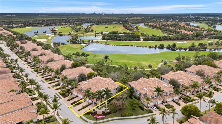 Savor the best of everything in this beautifully maintained coach home in Fiddler's Creek, a gated, private & pristine community. The 3 bedrooms + a den, 2 full baths home is 2408 under air; add a 2 car garage & an extended lanai for a total of 3200+ sq ft. This ground floor home has volume ceilings & pocketing sliders that open to a broad screened lanai where palms with orchids frame expansive views of the championship Arthur Hills golf course. Move in ready & spacious with both a 35 x 17 living room & a 16 x 14 dining/family room. The kitchen is a 15 x 12 L shape and the primary suite is 26 x 14 w large bath & 2 roomy closets. (Please click LINKS TO VIRTUAL TOUR/MULTI-FEATURE DOLLHOUSE FLOOR PLAN & more.) This coach home lives like a single family residence but exterior maintenance & yard care is someone else's job. Your job is to relax & enjoy the natural setting, connect with friends, entertain in the formal & informal spaces, share meals on the lanai, in the kitchen or under a living room chandelier. Cooking's a breeze with the gas stove, prep space on the granite countertops & stainless steel appliances + tall cabinets & a walk in pantry. Neutral tile floors extend to lanai. Carpet in den & bedrooms. Concerned about storms? With the push of a button the lanai is protected by electric hurricane shutters. The guest wing's 2 bedrooms & full bath are on the opposite side of the LR for privacy; if you live here, you will have guests! The den has French doors & is perfect to work from home or create a library, craft room or man cave. A long laundry has shelving, cabinets & a deep sink by the W/D & access to a 2 car garage. Fiddler's Creek is an award winning 4000 acre vibrant, verdant, amenities rich community located between Marco Island & Naples. Join a welcoming collection of neighbors in diverse neighborhoods that overlook tropical plantings & 2 highly rated golf courses. (Membership is optional). The hub of activity is the elegant 54,000 sq ft Club with a full-service spa, well equipped fitness center, a wide range of sports, social activities & events. One striking feature of the Club is a lakeside necklace of crystal clear pools w waterfalls, slides, swim lanes & lagoons set amid towering palm trees. Above the multi-pools are sun soaked terraces for those who want to catch some rays or order a catch of the day fish sandwich & cocktails poolside at Gator Grille. Exquisite fine dining awaits in the Club's luxurious Caxambas restaurant. Yes, there are tennis & pickleball courts, a lakefront gazebo & a tot lot by the imposing clubhouse.(There's a refundable membership initial contribution plus a 1 x fee for the Club.)  Bike paths weave past miles of waterways, fairways & acres of preserves. This home is perfectly located; about 15 minutes from the beaches on Marco Island or 20 minutes to the galleries, shopping & gastronomic delights of Naples. Residents may join an exclusive beach club & marina. Easy to see & show, buyers & agents welcome.