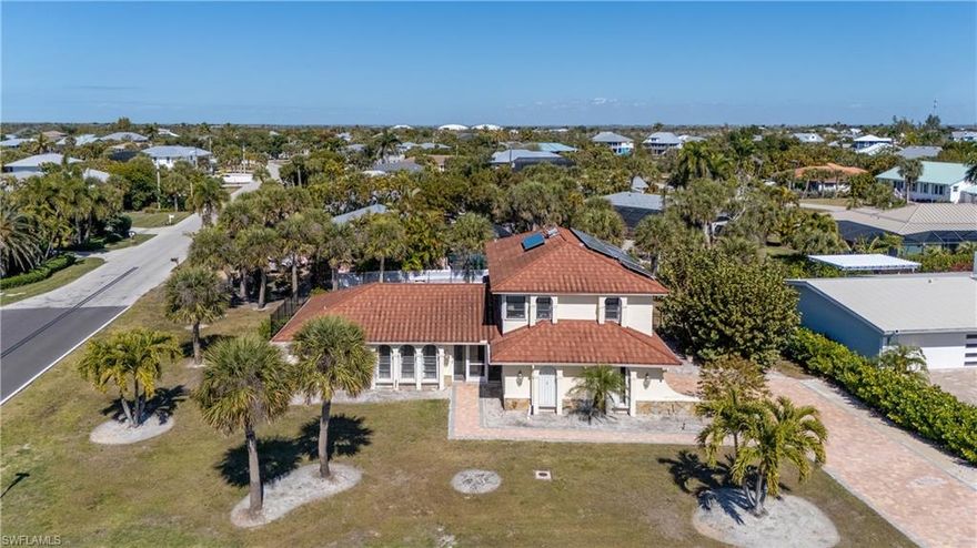 Set within a highly desirable Sanibel Island community, this oversized corner homesite is only a short 5-minute walk to beach access! Updates have already begun on the lower level including new LVT flooring, offering the perfect opportunity to complete your dream home with your own custom vision. This over 2800sqft home includes 4 bedrooms and 3 full bathrooms, with 3 bedrooms and 2 baths conveniently located on the main floor while the upper level provides a private bedroom retreat with its own full bath and large walk-in closet. New brick pavers enhance the driveway and walkway extending to the backyard, while the pool area boasts a resurfaced pool and spa, updated equipment, new brick pavers, and a new fenced rear yard. The exterior features a long-lasting metal roof designed to replicate the classic look of tile. Also includes 2 Newer HVAC systems, a home solar water heater and storm shutters on all windows. With ample interior storage, 2 car garage and a generous number of bedrooms, this home is ideal as a full-time residence, second home or seasonal rental property!