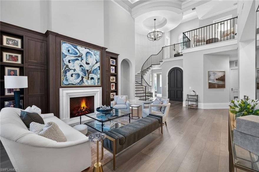 Fully Furnished - Professionally Decorated, and More Spectacular in Person!

Everything stays in this 4-bedroom, 5-bath masterpiece.  The home was fully transformed in 2023 and stands as the pinnacle of refined living in one of Florida’s most exclusive golf and country club communities - Shadow Wood at The Brooks. Meticulously crafted for the discerning buyer who accepts nothing less than perfection, the residence is completely turnkey: simply arrive, unpack your wardrobe, and immerse yourself in an unparalleled lifestyle.

No expense was spared in this comprehensive transformation. The entire interior was reimagined with a new solid oak circular open-tread staircase and banister, architectural-grade 8-foot solid-core doors, 12-inch baseboards, 10-inch crown molding, and walnut stained new white oak wood flooring throughout. Soaring 10- and 20-foot ceilings create dramatic volume, highlighted by a show-stopping Isokern fireplace wrapped in solid white crystal Italian marble.

The chef’s kitchen features solid cherry cabinetry finished in Italian white, premium stone counters, and Waterstone polished-nickel faucets. Built-in custom oak cabinetry elevates both the family room and formal living area.

Bathrooms are true works of art, showcasing Ruben Sorhegui waterjet marble mosaic tile, English Shaw handcrafted sinks, Toto Neorest intelligent toilets, and a powder bath with a gold-leaf faucet. Throughout the home there are Visual Comfort and Hudson Valley light fixtures, Emtek polished nickel hardware, Lutron lighting, Sonos whole-home audio, automatic hurricane shutters, automatic blinds, custom drapery, silk bedding, and York grass-cloth walls deliver a sophisticated, cohesive palette. Systems upgrades include a new roof and insulation, enhanced electrical and plumbing, Navien tankless gas hot-water heater, and brand-new pool equipment with automation.

Outside, an expanded driveway welcomes you, while the rear outdoor living area gives way to golf course and water views.

Fully furnished and decorated with the finest selections from Baker Furniture, Robb & Stucky, and Restoration Hardware—plus commissioned original paintings throughout—this 4-bedroom, 5-bath residence is genuinely move-in ready. Nothing to renovate, nothing to shop for—only exceptional living awaits.

Luxury of this caliber is exceptionally and extremely rare. If you seek the absolute best and immediate occupancy in Shadow Wood at The Brooks—with its championship golf, tennis, fitness facilities, private beach club access, and the exciting new Lifestyle Center (resort-style pools, indoor pickleball, poolside dining, and more) opening in 2026—schedule your private showing today.