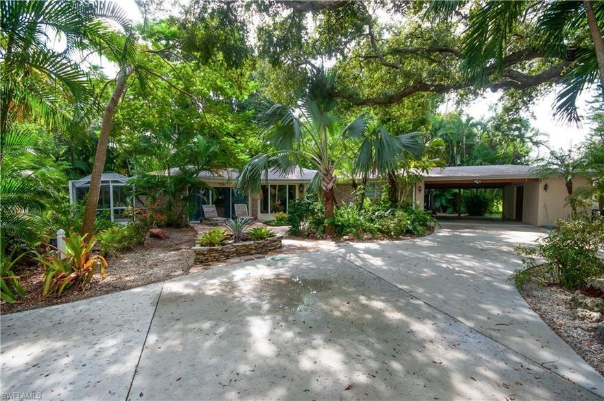 Your new vacation home in paradise awaits you, complete with 2 docks, boat lift and mature landscaping at the end of a quiet cul de sac. With all three bedrooms having their own complete bathroom, 2 with patios, just think about the fun you could have with friends and/or family as you make your way up the canal to the Imperial River leading to the Gulf of Mexico! Or drive to Bonita Beach in under 10 minutes. Two patios plus a front court yard style patio and a screened porch makes it the perfect place to quietly relax and enjoy the natural beauty of SW Florida. You would never know that you are only minutes away from all the conveniences of the international airport, Florida Gulf Coast University and various performing arts centers. Truly a unique home, it was renovated once in 2000 and again in 2008 with the old style hard copy survey from 1983 before the 2000 addition. Sold unfurnished - current furnishings are for staging purposes.