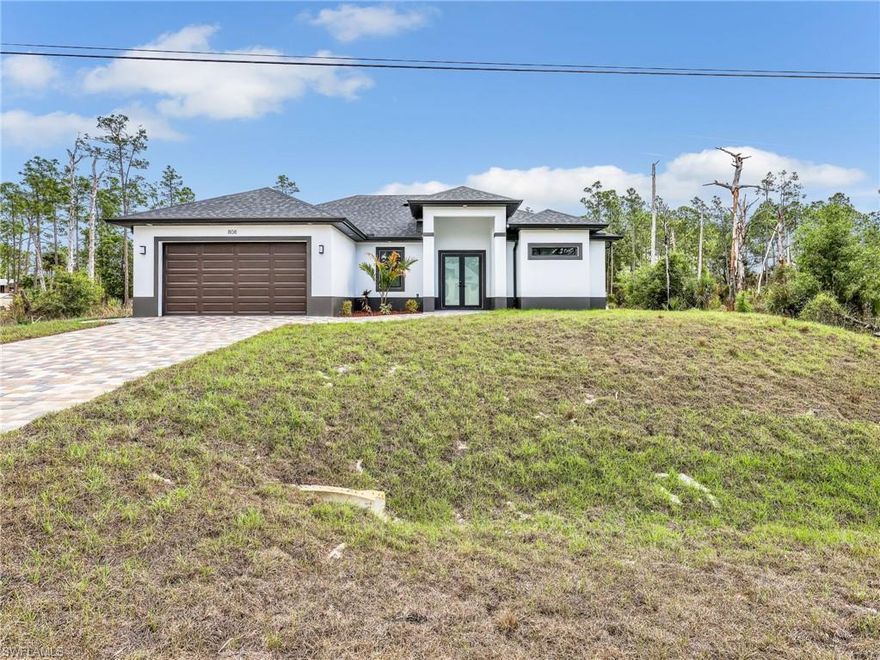 The most stunning NEW CONSTRUCTION on a HALF-ACRE LOT in Lehigh Acres, located on a QUIET STREET. This home offers 4 BEDROOMS and
2 BATHROOMS with an OPEN CONCEPT layout and SUPER HIGH CEILINGS. The BATHROOMS feature FLOOR-TO-CEILING TILE SHOWERS and
FRAMELESS GLASS DOORS. The MASTER SUITE includes DUAL WALK-IN CLOSETS, an OVERSIZED SHOWER, a TUB, and DOUBLE VANITIES.
The KITCHEN showcases a LARGE ISLAND, and the LAUNDRY ROOM is equipped with CUSTOM CABINETS and a UTILITY SINK. Additional
highlights include a CHALET-STYLE LANAI with TILE FLOORING, IMPACT WINDOWS AND DOORS, a DRIVEWAY WITH PAVERS, an EPOXYCOATED GARAGE FLOOR with SIDE ENTRY, PENDANT LIGHTS and CEILING FANS and MAINTAINED LANDSCAPING. CLOSING COSTS
CONCESSIONS AVAILABLE FROM THE SELLER.