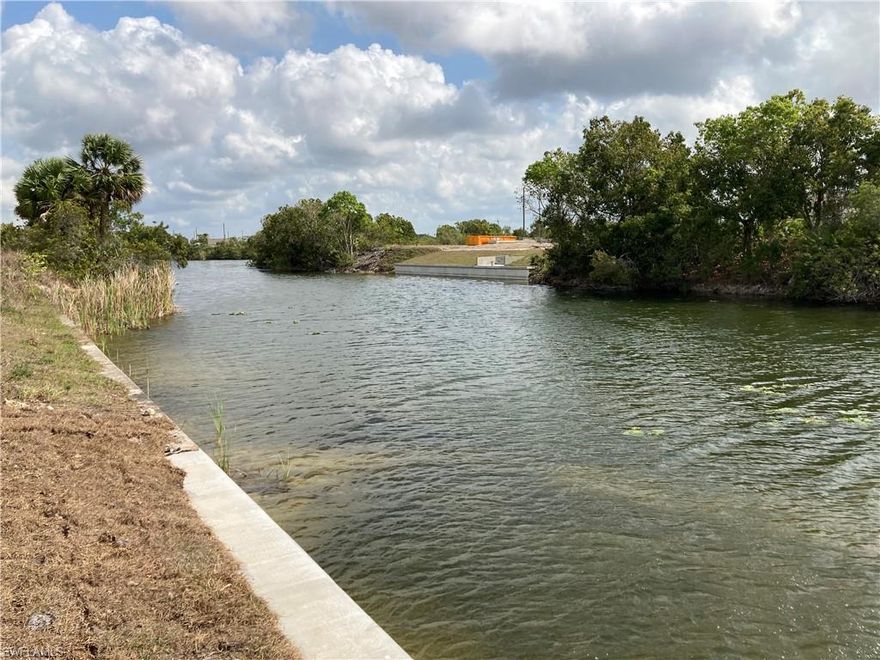 SEAWALL IN!  BUILD YOUR HOME NOW!  NO FLOOD INSURANCE REQUIRED!  Wide 120 ft canal is 1 1/2 times the width of most canals in area. Attractive upscale neighboring homes!  And Beautiful new homes being built as your future neighbors!  Want no neighbor behind your lanai? Then you'll love the 120-ft wide freshwater canal behind this lot. Kayak, boat, and enjoy Great bass fishing from your future dock.