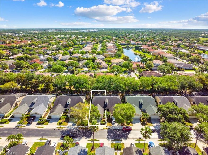 This beautifully maintained and updated attached villa of Ibis Cove leaves nothing to be desired.  From the front door, your foyer will lead you to the two guest bedrooms/full bath, kitchen straight ahead, and spacious dining/living area off to the left.  Designed to entertain from all angles, your guests can enjoy the action in the kitchen and living area from the high top stools in the formal dining area.  The chef in you will be pleased to find spacious quartz countertops, double sink, convertible island, and casual eat-in area with natural light from the large window.  Convenience is enhanced with your laundry & 2 car garage tucked away just off from the kitchen.  With updated laminate flooring throughout, the living & formal dining space is expansive with high ceilings. The large primary bedroom boasts double walk-in closets, water closet, dual sinks, & spa style walk-in shower.  Beyond the living area, enjoy your second living area while you sip on morning coffee.  On a sunny day, bask on your enclosed lanai.  Just off Immokalee Rd, you are centrally located to all that SWFL has to offer with a 5 min drive to 75, 15 min drive to the beach, & 25 min drive to downtown Naples!