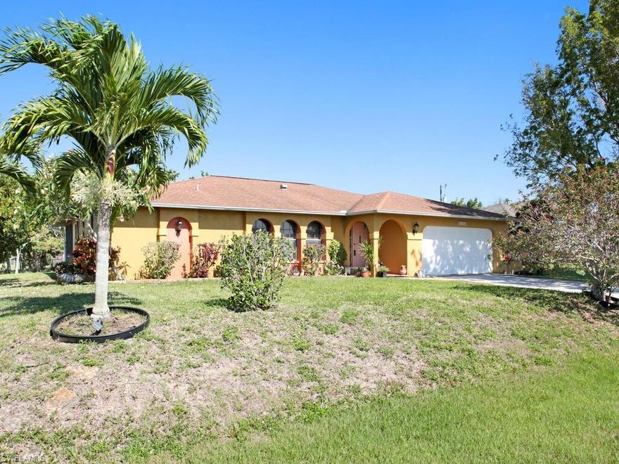 This 3br 2b home is on a large corner lot with plenty of room and has an attached 2 car garage. The huge yard, a large, screened lanai, and an open design makes this home perfect for entertaining. Has a newer A/C (2017), and the assessment has already been paid. Great location.