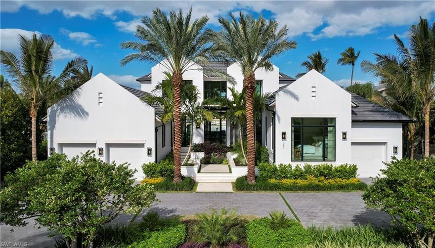 A destination unlike any other. Overlooking beautiful Bowline Bay, steps from the Gulf of Mexico, with deepwater direct gulf access (no bridges), and a short walk to the acclaimed new Four Seasons Resort sits your spectacular new waterfront living experience of a lifetime. Designed for gracious living by Stofft Cooney Architects, thoughtfully constructed by Knauf Koenig Group and spectacularly finished and furnished by Calusa Bay Design, this gorgeous 6950 ac sf/9000 + ttl sf estate features a generous and open floor plan, filled with natural light, streaming from floor to ceiling windows complemented by hand knotted rugs scattered over wide plank European White Oak floors. A custom designed chefs kitchen, perfect for hosting an intimate family gathering or a dinner party for 30 is complimented by the well appointed Butler’s pantry/catering kitchen, wet bar and well stocked 700 + bottle wine room. A beautifully appointed great room with design inspired feature wall and adjacent formal dining with gorgeous millwork detail flow seamlessly into a stunning 1200 sf outdoor living space, all overlooking wide water views of Bowline Bay. Relax in the downstairs clubroom, a quiet and spacious secondary living space for work or simply relaxing with a book. The master suite provides a spa like retreat, with open beam vaulted ceiling, generous closets and every upgrade one would expect in a residence meticulously designed for those who seek luxury waterfront living at its finest. The master and VIP guest suites are ideally located for maximum privacy on the first floor, while 4 en suite guestrooms and a large upstairs lounge provide a beautiful and comfortable upstairs guest space overlooking the pool, Bowline Bay and beautiful sunsets over the Gulf of Mexico. You will appreciate the fine millwork in the ceilings, feature walls, and spectacular two-story glass and wood staircase. The finest finishes and furnishings were curated to create a five star resort style living experience, clearly evident throughout this breathtaking 6 en-suite bedroom, 8 bath, 3 - 6 car garage estate home. An extensive custom landscaping package envelopes the site with swaying palm trees, exotic plantings, and complete privacy. With full concrete construction and built to exceed FEMA requirements, a generous and open floor plan, a full Crestron lighting control package, and pre-wired for a full complement of security and audiovisual components, this Crestron smart home will not disappoint. One of only 50 home sites in Naples west of Crayton Rd (the “Nifty 50“), serious boaters will appreciate the direct, deep water gulf access with no bridges, and plenty of room to park your custom yacht right at your back door. Centrally located in the desirable Moorings neighborhood, this exclusive residence features a coveted and relaxing lifestyle that is simply without compare. Completion December 2024.