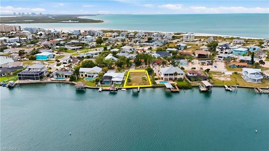 Discover a rare opportunity to be part of the exciting renaissance of Fort Myers Beach with this exceptional oversized waterfront lot in the coveted Laguna Shores community. Perfectly situated along the scenic lagoon, this property offers a tranquil setting with beautiful water views and direct, quick access to the Gulf, just 5 minutes to the open water—ideal for boating, kayaking, or simply embracing the coastal lifestyle.

Located on the quiet and private south end of the island, Laguna Shores is known for its peaceful atmosphere and hidden charm, making it a true retreat away from the crowds. Privacy is the most talked about feature of this property and you’re perfectly positioned to enjoy everything the area has to offer. Fort Myers Beach is experiencing a remarkable revitalization, with new development, refreshed amenities, and a renewed energy that’s bringing the community back better than ever—making this the perfect time to invest and build your dream home.

Convenience is key, and this location delivers. You’re just a short drive to Naples and Bonita Springs for upscale dining, shopping, and entertainment, and only minutes from Southwest Florida International Airport for easy travel. Nearby Santini Marina Plaza adds to the appeal with a variety of local shops, restaurants, and marina access right around the corner.

Whether you envision a luxurious waterfront estate, a seasonal getaway, or a smart investment in a rapidly rebounding coastal market, this property offers endless potential in one of Southwest Florida’s most promising locations. Come be part of the future of Fort Myers Beach while enjoying the timeless beauty of waterfront living today.
