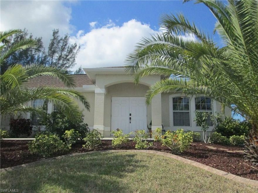 Beautiful 3 bedroom, 2 bath, plus den pool home on Fresh Water Canal.  Step into the the double door entry and immediately feel the spaciousness of this well cared for home. The open design of the kitchen and Great Room is the perfect place to entertain family and friends. The vaulted ceilings add to the brightness of this cheerful and inviting home. Enjoy your morning coffee at the breakfast bar or on the recently added large screened  pool and covered paver lanai overlooking the navigable canal and dock.  The grounds around this home are lush with tropical trees and foliage.   Close to shopping entertainment and restaurants. Be sure to schedule your private showing today!