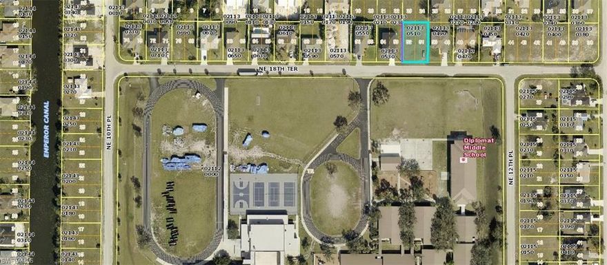 This prime 0.25-acre lot is located in the heart of Cape Coral, offering an unbeatable central location just minutes from Diplomat Middle and Elementary Schools. Positioned near the major intersection of Diplomat Parkway and Del Prado Boulevard, this lot provides easy access to shopping, dining, and essential services. Its convenient proximity to main roads makes commuting simple while still being nestled in a quiet and established neighborhood. Perfect for building your dream home or an investment property, this lot offers the ideal blend of suburban tranquility and urban convenience.