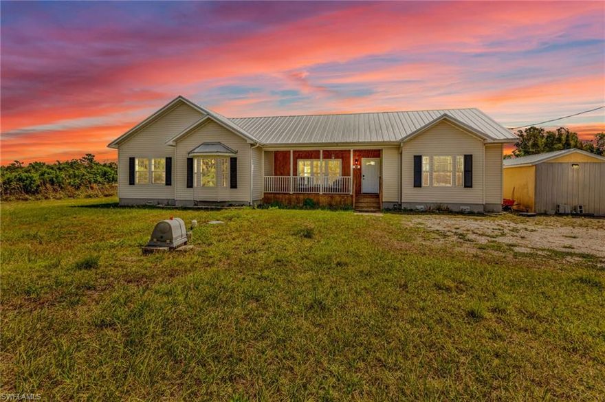 PRIVATE 2.5+/- Acre Remodeled Home in Punta Gorda! New Metal Roof (2023), flooring, kitchen, and so much more! No flooding or flood zone, No HOA, No Deed Restrictions! Zoned AG – bring your animals and toys! Open floor plan, natural light through expansive windows, high ceilings with crown molding. Front and back porch, perfect for rocking chairs and enjoying the peace and quiet that comes with country living. Spacious living areas that flow seamlessly from living room, to dining room and family room to the open kitchen – plenty of room for a furniture island. Brand NEW kitchen with granite countertops, stainless steel appliances, closet pantry, and single bowl farmhouse sink with a large window above to enjoy your natural backyard view. Primary ensuite bedroom with large walk-in closet, separate vanities, and walk-around shower. Wonderfully designed laundry/mudroom with built-in storage, cubbies and access to the outside. Split bedroom plan, both guest rooms are spacious with lots of closet storage. Storage shed, inside built-in safe, and corner cabinet – details that make this home special.