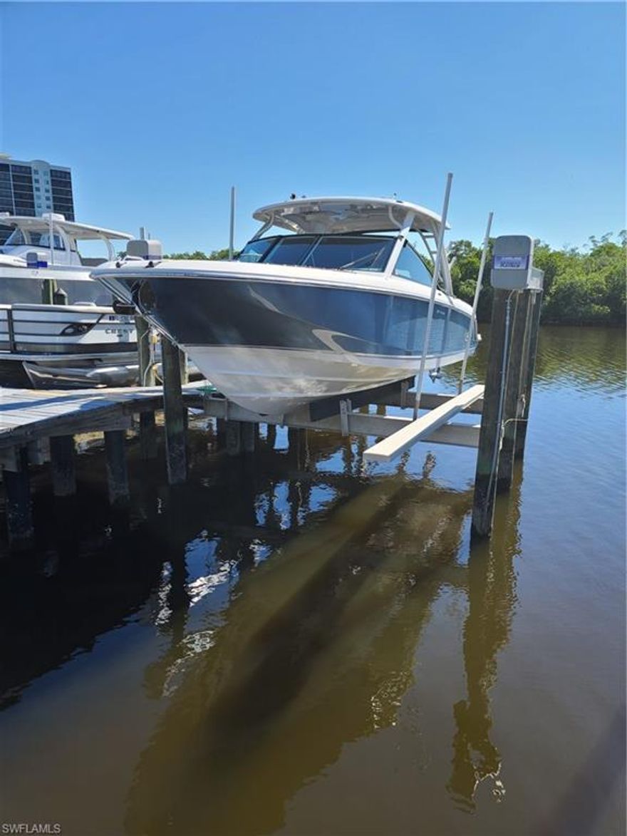 This slip is one of the largest in the Marina and can accommodate a boat up to 42 feet. There is a 3-year-old 20,000# lift installed. One 13 +/- clearance bridge separates this slip from the Gulf of Mexico. Quick direct access only minutes away. Tarpon Cove Club is available to join and would complete the package, with resort pool, dining, showers, etc. An annual maintenance fee of $1,720 - includes water, light, trash removal, dock maintenance, professional management. Slip is subject to a submerged land lease with the State of Florida. Buyer will receive a Dockage & Mooring agreement ( see attachments) permitting them to use this  #239 dock numbered space. There is a 6.36 % lease fee on the purchase amount payable to the Wiggins Bay Dock Owner Association.