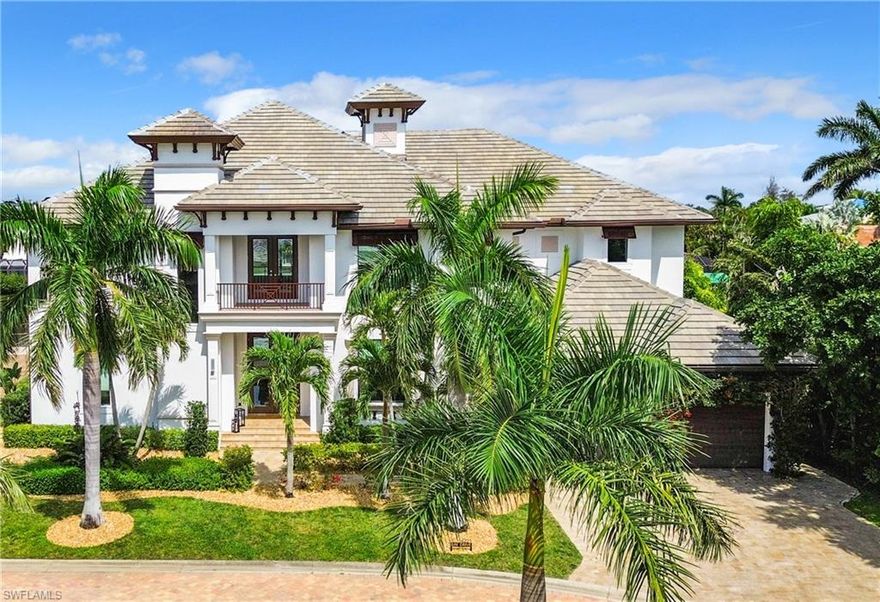 Yes, you can have it all!  Location, comfort, convenience and luxury all at your fingertips. Just off McGregor Blvd., minutes from beaches, restaurants, and shopping. Don't pass up the opportunity to own your own piece of paradise in this exclusive, gated, three home community. A boaters paradise on a deep water canal providing easy, direct (no bridges) Gulf access.  Ample 80 feet of captain's walk with parking for your large vessel plus additional 10k pound boat lift.  200 amp power and water available at the dock. Have a big family or love to entertain? Enjoy this Smart home with over 5500 sq ft of living space and over 6500 sq ft of total living area.  The outdoor space includes an infinity edge heated pool with spa and water feature, pool bath and multiple seating areas.  Meals are enjoyable to prepare in the summer kitchen complete with built in gas grill, ice maker, beverage fridge and plenty of granite counter space.   The inside boasts a magnificent great room with a soaring ceiling to the second story and gorgeous glass railings over head.  Two main floor master suites each with full ensuite bathrooms and dual closets.  Off the kitchen is a combination butler's pantry and laundry room for the multi-tasker in the family.  The home is elevator ready with a shaft that extends from the three car garage up to the second story.  This is luxury at its finest and shows true pride of ownership.