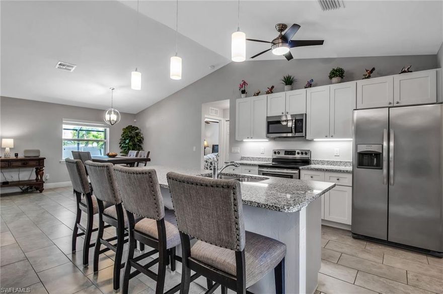 **BEAUTIFUL LIKE NEW HOME LOADED WITH UPGRADES** Just bring your luggage includes all furniture, decor, and electronics (automobiles not included).  This 2018 Build Smart home (can be run from your mobile app) has it all! Large entry foyer with high cathedral ceilings, spacious floor plan, tile floors throughout, beautiful kitchen with snack bar, granite counters and 4-piece stainless steel appliance package.  Automated hurricane shutters that can be opened and closed from anywhere using your mobile phone. Large laundry room with storage closet. This home features a split floor plan. The main master features his/hers closets and tray ceilings. The master bath has dual sinks with granite counter tops. Exterior features include an extended lanai with an outdoor kitchen and fire pit. 2019 new heated pool with screened in lanai and UPGRADED landscaping everywhere with the best palm trees money can buy . City water, sewer, and irrigation.  Southwest Cape Coral is the best living The Cape has to offer this home is close to all the action the best restaurants, banks, dentists, supermarket, salons, boating and more.  FHA Offers welcome... Personal items not included. Please schedule your private showing today.