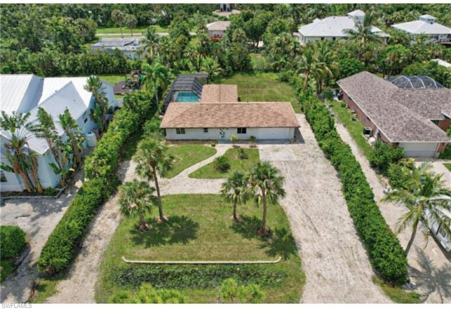 Discover an exceptional opportunity in the highly sought-after Iona neighborhood of Fort Myers. This mostly renovated 3-bedroom, 2.5-bath pool home offers incredible potential for investors or buyers looking to customize a property in a prime location just minutes from the beaches of Sanibel, Captiva Island, shopping, and dining.

The home features a spacious and functional layout with strong bones already in place. The walls are finished beautifully, and the updated flooring throughout creates a clean, modern foundation. Large windows and sliding glass doors fill the home with natural light and provide stunning views of the pool, enhancing the indoor-outdoor living experience.
This home gives the new owner a blank canvas to design and build their dream kitchen exactly to their taste. The bathrooms are partially completed and ready for final finishes, allowing for customization while avoiding major structural work. The primary suite offers generous space, a large bathroom area, and a walk-in closet, while the additional bedrooms provide ample room and storage.

Step outside to a private backyard retreat featuring a large screened lanai, and outdoor shower—ideal for entertaining or relaxing year-round. Situated on a spacious half-acre lot in a quiet, well-established neighborhood, the property also includes an oversized 2-car garage with room for storage or a workshop.

Offered AS-IS this property presents a rare opportunity to add immediate value. With a new roof, updated flooring, modern lighting, and a solid layout already in place, this home is perfectly positioned for a profitable renovation or a personalized forever home in one of Fort Myers’ most desirable areas.
The property is sold As-Is, Where-Is. Seller has no knowledge, buyer should perform their due diligence and make their own assessments.
Some photos are virtually staged.