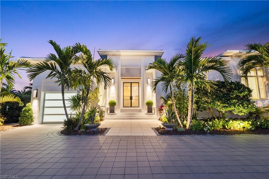 London Bay Homes' Portmore: Prime Park Shore corner lot. Architectural and color harmonies. Romanza-designed, art-enriched interiors. Custom millwork, layered lighting, high beamed ceilings. Open living, clerestory windows, natural light. Four en suites, office, butler's pantry. Southern exposure, indoor-outdoor fusion, infinity pool, hedged deck, fire pit. Fully turn-key furnished, high-end finishes in meticulous, pristine condition. Programmable Lutron lighting, advanced security. Soho-designed kitchen, Miele suite, waterfall counters. Equipped catering pantry, ice maker, comprehensive bar library. Zen modern garden, innovative landscape, Burle Marx tribute. Sculpted garden beds, palm court, unique stone art, Florida palm collection. Dual garages, multi-car parking, lift-ready tall ceilings. Whole house 32Kw generator, AquaKleen whole-house water filtration system, Sonos sound system, Buzz Off Mosquito system, & video cameras integrated as part of security system.