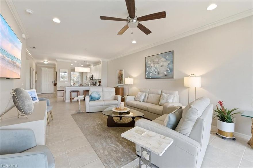 IMMACULATE and exquisitely appointed, this 2 Bedroom + Den, 2 Bath first-floor end-unit residence is gracefully positioned at the end of a quiet cul-de-sac, with convenient guest parking just steps away. Bathed in natural light, the home showcases an open, airy floor plan with expansive sliding glass doors that lead to a covered, screened lanai—an inviting retreat for morning coffee or evening cocktails, all set against tranquil lake and preserve views. Ideally situated alongside the community’s scenic walking and biking trails, you can effortlessly explore miles of beautifully maintained pathways winding through lush natural surroundings.
The spacious primary suite is a private sanctuary, offering serene water views, a well-appointed bath, and dual closets that provide both comfort and functionality. The guest bedroom is generously sized and thoughtfully designed as a private en-suite, complete with a custom office/shelving system, as well as ample closet space. The kitchen is both stylish and functional, featuring abundant counter space, an upgraded backsplash, white shaker-style cabinetry, GE stainless steel appliances, and a charming breakfast nook.
The main living area is open and inviting, enhanced by upgraded lighting fixtures and complemented by a versatile den with a window that fills the space with natural light. Currently utilized as a dining area, the den offers flexibility to suit a variety of lifestyles.
Additional highlights include tile flooring throughout the main living areas and den, crown molding in the living room and kitchen, a hurricane-rated lanai shade, and a detached one-car carport with a private storage closet.
Residents of Esplanade Golf & Country Club enjoy a nationally recognized, resort-style lifestyle, highlighted by a stunning grand entrance and an exceptional array of amenities. These include a championship golf course, resort-style pool with cabanas and poolside service, Bahama Bar, a beautifully appointed clubhouse with fine dining, tennis and pickleball courts, fitness and wellness centers, a full-service spa and salon, scenic trails, a dog park, and more. Ideally located in North Naples, just minutes from I-75, the airport, premier dining, upscale shopping, and the pristine Gulf beaches.
This property includes a Club/Sports Membership, providing full access to all amenities along with limited golf privileges and two-day advance tee times. Monthly HOA dues cover water, sewer, building insurance, exterior maintenance, and complete access to the community’s amenities. Planned enhancements for 2026 include an expanded Bahama Bar and Clubhouse Bar, upgraded golf practice facilities and course design improvements, as well as a new indoor pickleball complex featuring four air-conditioned courts.
Experience the very best of Esplanade living—where luxury, lifestyle, and location come together seamlessly.