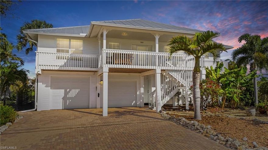 Direct Gulf Access with Dual Boat Lifts – Island Living in Bokeelia

Enjoy immediate, no-bridge Gulf access from your private dock featuring two electric boat lifts (6,000 lb & 10,000 lb)—a rare find for boating enthusiasts seeking quick access to world-class fishing and island hopping.

This elevated waterfront home offers 2 bedrooms + a den and 2 bathrooms upstairs, featuring an open-concept layout, tile flooring throughout, and a spacious screened porch with peaceful water and treetop views.

The lower level functions as a fully separate living space, complete with its own kitchen, bedroom, full bathroom, living room, and private lanai—ideal for guests, extended family, or added rental potential.

Surrounded by lush tropical landscaping, the property showcases exotic plants, fruit trees, native wildlife, and a private outdoor shower—capturing the true essence of Florida island living.

A large garage with rear access provides ample storage for vehicles, boats, and equipment. Recent updates include a new metal roof and gutters (2023) and a durable Hardie Board exterior for low-maintenance ownership.

Located in the highly desirable Ann Arbor neighborhood, this unique property offers privacy, flexibility, and the ultimate Pine Island waterfront lifestyle.