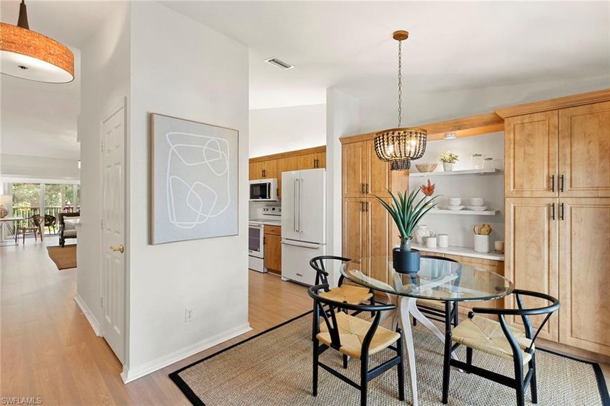 Beautifully renovated second floor condominium in the heart of Pelican Bay. This light-filled residence in Laurel Oaks pairs vaulted ceilings with two screened lanais for an airy indoor-outdoor flow. Featuring an open living area, a split two-bedroom, two-bath plan, and a well-placed beautifully updated kitchen with casual dining. Move-in ready and peace-of-mind updates where it matters most such as newer air conditioner, plus community improvements including new roofs, new carports and updated landscaping. Laurel Oaks offers a sparkling pool, spa and social room in a quiet, park-like setting, while Pelican Bay delivers lifestyle Naples is known for such as private beach clubs with chair/umbrella service and beachfront dining, miles of recreational paths, a fitness and wellness center, tennis and pickleball, and convenient beach tram. All this moments from Waterside Shops and Artis-Naples, and a short drive to Mercato and Fifth Avenue South. If you're seeking the Pelican Bay experience without a tower price or a project list, this Laurel Oaks condominium is the effortless yes.