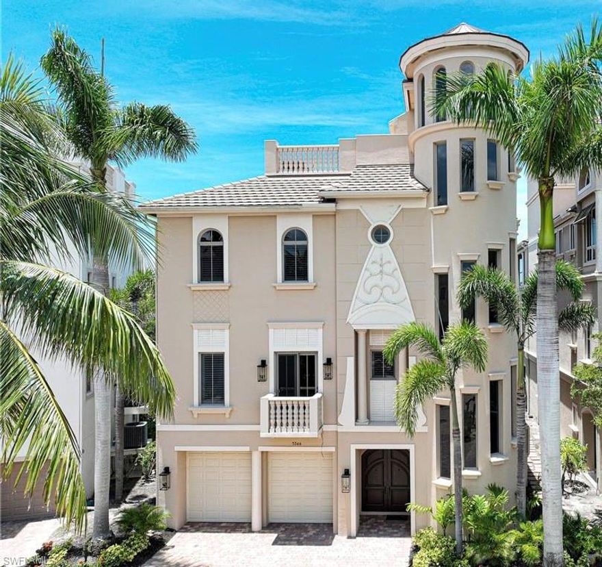 This 4 Story Barefoot Bay home offers everything: 50 PERCENT OWNER FINANCING AT REASONABLE TERMS, short walk to Barefoot Beach, premier boating with dock & 10,000lb lift out your back door, quick trip to Gulf no bridges, Damon built all concrete construction with Anderson Impact windows, elevated swimming pool & spa with negative edge, overlooking wide long water views, the most desirable SW exposure, home has had a cosmetic update throughout in light coastal style, a private enclave of 9 homes that is gated and the elevator goes to the 4th floor outdoor entertaining tiled deck and summer kitchen (protected by electric shutter) with forever views & sunsets over the the Gulf to the west plus incredible bay views north & south. Features inc 5 bedrooms, 5 1\2 baths, 2 dens and a 3-car & tiled floor garage, private elevator, open floor plan, 10' sliders in the great room with large modern fireplace, dining room overlooks the water, large master suite with lanai overlooking the bay, security system, both 2nd and roof level have gas grills, coffered ceilings to 12', modern surfaces, and is decorator furnishings are negotiable. Home is in move in ready pristine condition.
