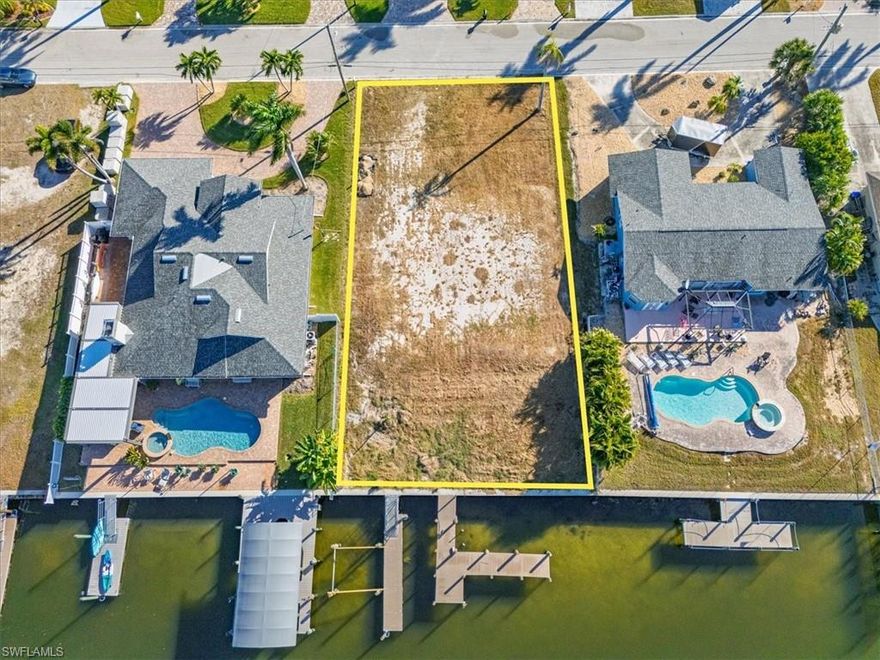 Located in the sought-after boating community of Siesta Isles, this cleared waterfront lot offers direct Gulf access with no bridges and quick, easy access to open water. Ideally positioned just before the bridge to Fort Myers Beach, the location allows you to enjoy boating and beach life while avoiding heavy island traffic. The property features new floating docks and a new bulkhead, providing a solid foundation for your future home. The seller has already invested in professional home renderings and is willing to include them with the sale—a valuable bonus for a buyer ready to build. Enjoy a short bike ride to Fort Myers Beach, along with nearby restaurants, bars, and live music. Seller financing is available, making this an excellent opportunity to build in one of the area’s most desirable waterfront neighborhoods.