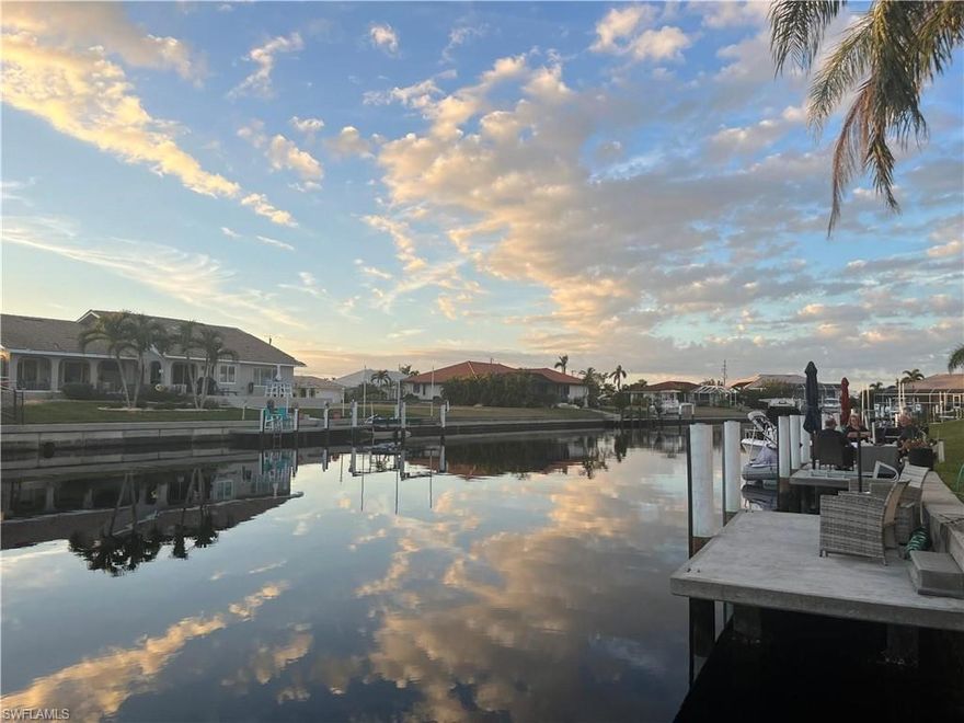 One or more photo(s) has been virtually staged. Live your Florida waterfront dream in this immaculate, fully updated 2-bedroom condo in Punta Gorda Isles. Just a 12-minute boat ride to Fisherman’s Village! Dock your boat or keep a ski at the permitted floating dock (pilings redone 2023) and enjoy world-class boating and fishing from your backyard. Inside, you’ll find impact windows, luxury vinyl flooring, and a modern kitchen with top-of-the-line GE Monogram appliances, Bosch dishwasher, and reverse osmosis water filtration. The 2021-renovated bathroom  features a step in shower with drop down seat, a rain shower and sleek storage, behind the large mirror.  The second bedroom includes  a laundry center, Murphy bed and barn door for flexible use. Newer AC, water heater, (2021) metal roof (2022), impact windows and hurricane shutters ensure peace of mind. HOA covers flood insurance, sewer, water, trash, pest control and lawn care for truly maintenance-free living. Small pet-friendly, with assigned parking, climate controlled storage, and guest parking spots. Enjoy the active Punta Gorda Isles lifestyle—tennis, pickleball, local festivals, and an easy stroll to waterfront dining. This move-in-ready condo offers comfort, convenience, and a true coastal lifestyle. One or more photos virtually staged.