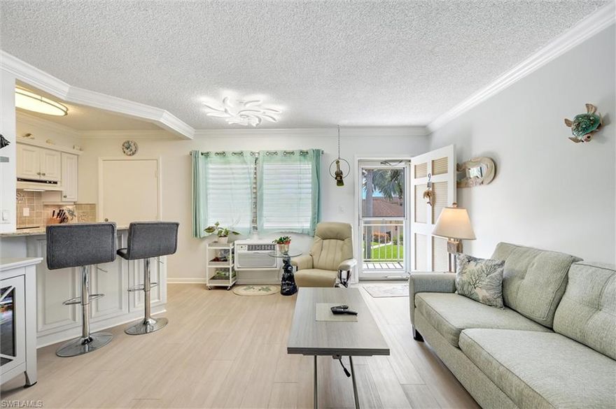 The Unicorn property you have been looking for! A remodeled 1-bedroom, priced right and located near everything Marco Island has to offer. This second-floor unit offers added peace of mind above ground level, along with low, affordable condo fees. Many main furniture pieces convey, making this a true move-in-ready opportunity. Recent updates include a new hot water heater and newer air conditioning units allowing for immediate comfort and convenience. Located just a block away, directly across the street, is the exclusive Residents' Beach. Aquarius is a charming and well-maintained community ideally situated on North Collier Boulevard just a short stroll to Marco Island's pristine beaches, as well as its shopping and dining destinations. Inside, the thoughtfully designed second-floor layout features a bright, coastal-inspired interior with abundant natural light. The open-concept living and dining areas create a comfortable space for both relaxing and entertaining. The kitchen has been tastefully updated with granite countertops and bar area, newer appliances, blending style and functionality. The spacious bedroom offers a peaceful retreat with generous closet space, while crown molding throughout adds a refined finish. Step outside and enjoy the lushly landscaped grounds or unwind in the community pool, perfect for cooling off after a day in the sun. Extra storage unit is located on site with laundry facilities. Aquarius is known for its welcoming atmosphere, low-maintenance lifestyle, and unbeatable location, making this an exceptional opportunity at this price point. Whether you're seeking a full-time residence, seasonal escape, or investment property, this one checks all the boxes. This is a rare chance to own your own slice of paradise without breaking the bank.