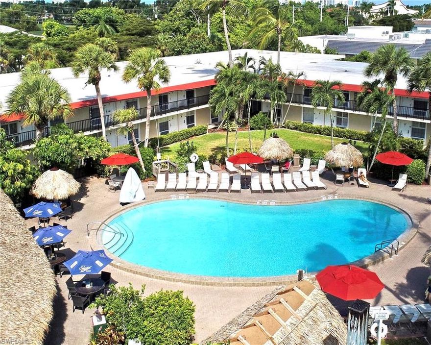 Resort Style Living in Paradise with Investment Income Opportunity makes this Unique Property at the Gulfcoast Inn Highly Desirable, at a bargain price in one of the most expensive cities in the United States! Ideally Centrally Located on Tamiami Trail, in the Upscale Moorings of Naples, just one mile from the World-Class white sandy Beaches of the Gulf of America and minutes from Old Naples shopping, dining, and entertainment. This 2nd floor studio/condo hotel unit is above hurricane flooding worries and offered turn-key furnished and ready for immediate occupancy or the rental program. The property provides exceptional flexibility with no minimum or maximum stay requirements, making it ideal as a personal getaway, long-term or short-term rental, seasonal residence, or additional accommodations for visiting friends and family. Owners may participate in the on-site rental program making money easy. Residents and guests enjoy Resort Style amenities including a large hotel pool with lounge chairs and umbrellas, tiki bar, daily continental breakfast, business center, social room, 24-hour security, on-site property management, and convenient laundry and storage facilities plus free parking! In addition to free Continental Breakfast and daily Coffee Bar in the hotel lobby and numerous ice and vending machines, there are Three On-site Restaurants include poolside fun, dining, and drinking at Harold’s Place, Vesuvio Pizza & Bar, and Fujiyama Hibachi Steak & Seafood. Monthly fees cover all utilities making ownership simple and cost-effective. PLUS NEW A/C, Refrigerator, and Microwave!