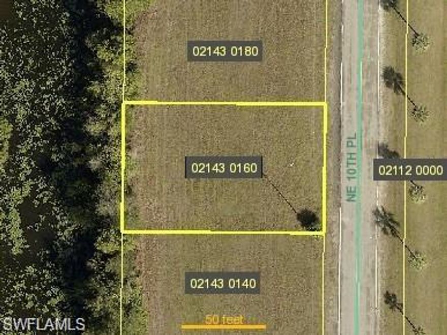 Beautiful homesite on freshwater canal in NE Cape Coral - Kayak or fish from your own backyard!! Quiet neighborhood with all the conveniences needed close by.   Quick access to Fort Myers or I-75.  Area in process of getting city utilities --- buyer to assume assessments and related fees.