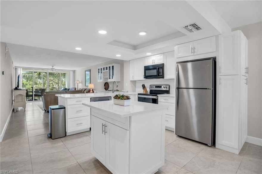 Prime location, renovated and turnkey furnished condo West of 41 in Naples!! Nothing to do but bring your clothes and start living your best Naples Lifestyle. This tastefully renovated 5th floor unit in Bay Forest’s Naples Cove features 2 bedrooms, 2 full bathrooms along with a laundry room. The remodeled kitchen is designed for open-concept living, featuring white cabinetry with detailed storage, stainless steel appliances, and quartz countertops leading into the wine bar and main living area for everyday enjoyment and entertaining. The private screened in lanai off of the living room has a southwest facing view of the peaceful preserve and the breathtaking sunset sky perfect for al fresco dining and relaxing in the Florida sun. The primary bedroom has a king size bedroom set, large walk-in closet and an en suite bathroom that has been fully remodeled with a stand up shower, glass doors and updated vanity overlooking the preserve. The secondary bedroom in the front of the unit also has a king size bedroom set and shares the renovated hall bath with a tub/shower combo and new vanity and mirror. Turnkey with well appointed furnishings, sheets, towels, and kitchen appliances. There is also a private storage unit by the elevator for beach chairs, bicycles and anything else you may need! Bay Forest is known for its relaxed pace of life and boasts an array of amenities, including an expansive bike and jogging path, bocce court, community clubhouse with pool/spa, fishing pier, and pickleball and tennis courts. Don’t miss an opportunity to own a piece of paradise in this sought-after community. Experience Naples living.. Call today!