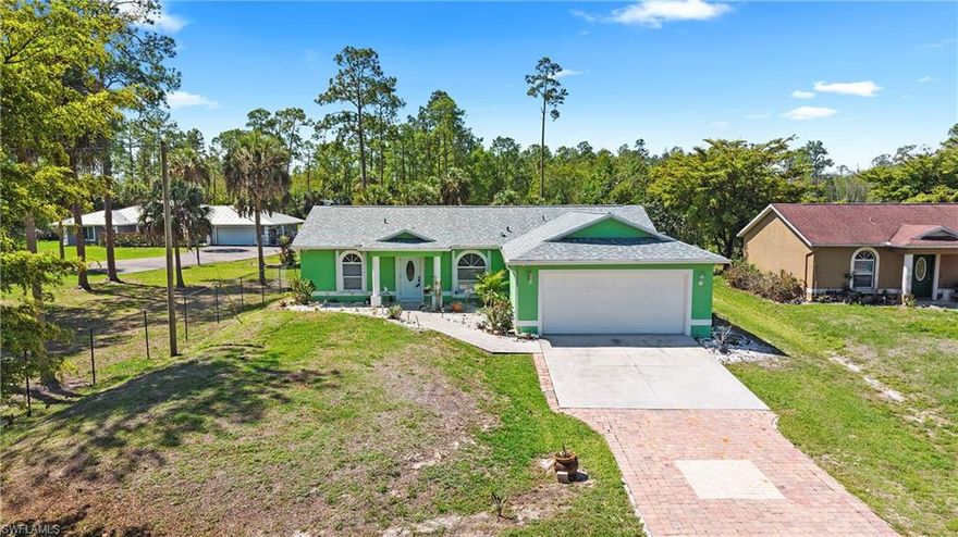 New roof just installed March of 2026!!  Value, value, value meets versatility in this stunningly refreshed 3-bedroom, 2-bathroom home that perfectly captures the essence of modern coastal design. Nestled on a 1.14-acre lot with full drivable access to the backyard, this property is a rare find for those seeking both space and style without the restrictions of an HOA. The interior greets you with a bright, open feel, featuring neutral coastal modern tones, durable tile flooring throughout, and a freshly painted interior anchored by a custom accent wall in the main living area. The heart of the home is fully equipped for the modern chef with brand-new stainless steel appliances, complemented by a new washer and dryer and designer light fixtures and fans that add a touch of contemporary elegance. Beyond the aesthetic updates, this home offers incredible peace of mind with a 2019 HVAC system, a new well sub-pump installed just two years ago, and manual hurricane shutters on all windows for total storm protection. Outdoor enthusiasts and hobbyists will appreciate the massive backyard and the handy 10x15 metal shed that comes fully wired for power, making it the perfect workshop or storage hub. This home offers incredible value and an unparalleled lifestyle of comfort and freedom at this price point.