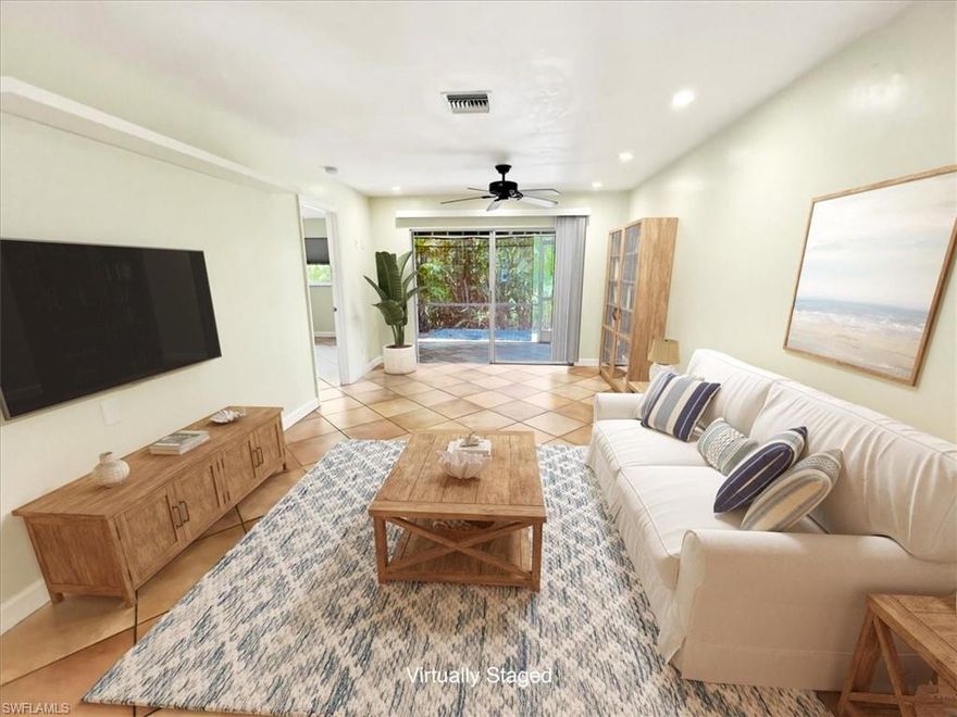 One or more photo(s) has been virtually staged, AI generated or rendered.  JUST LISTED! Live moments from the energy of Fifth Avenue South while enjoying the ease of low-maintenance Naples retreat. This stylish 2-Bedroom, 1-Bath END UNIT residence w/ 1 Car Carport with renovated good-sized storage closet great for beach chairs, grill or bikes, all this & close enough to indulge in world-class dining, boutique shopping, and white-sand Naples beaches, yet privately tucked away for everyday comfort. No Carpet - Spanish Tiles throughout including the Screened-in Lanai. UPGRADES & HIGHLIGHTS include: 2022 ROOF, asphalt road & driveway resurfacing, New Carport Canopies, Interior Painted, 2024 AC, Laundry in-residence 2023 Stackable Washer & Dryer, 2025 Dishwasher, Master Bath w/Large Shower w/glass shower doors & rain showerhead, updated Lighting Fixtures & Fans. Whether it's a spontaneous evening downtown or a quiet morning enjoying your coffee at home relaxing in your own screened-in Lanai or BBQ on your outdoor patio with friends & family, this location & southern exposure puts you exactly where you want to be. Prime Location  "Boca Ciega Village" is located in the well-established Lakewood community, surrounded by lush tropical landscape, plus walking distance to the community Pool. Low Condo Fees $508 a month. Owners allowed 2 pets with 25 lb max weight. Short drive to downtown 5th Ave & Third St South shopping & dining, entertainment, Tin City & Bayfront boating & recreation & Kings Lake Plaza - Public, Tacos & Tequila, Aldos, Hair & Nail Salon, Dry Cleaner and more. This chic condo would be great as a seasonal escape or full-time residence. RARE opportunity & prime location, it will not last!