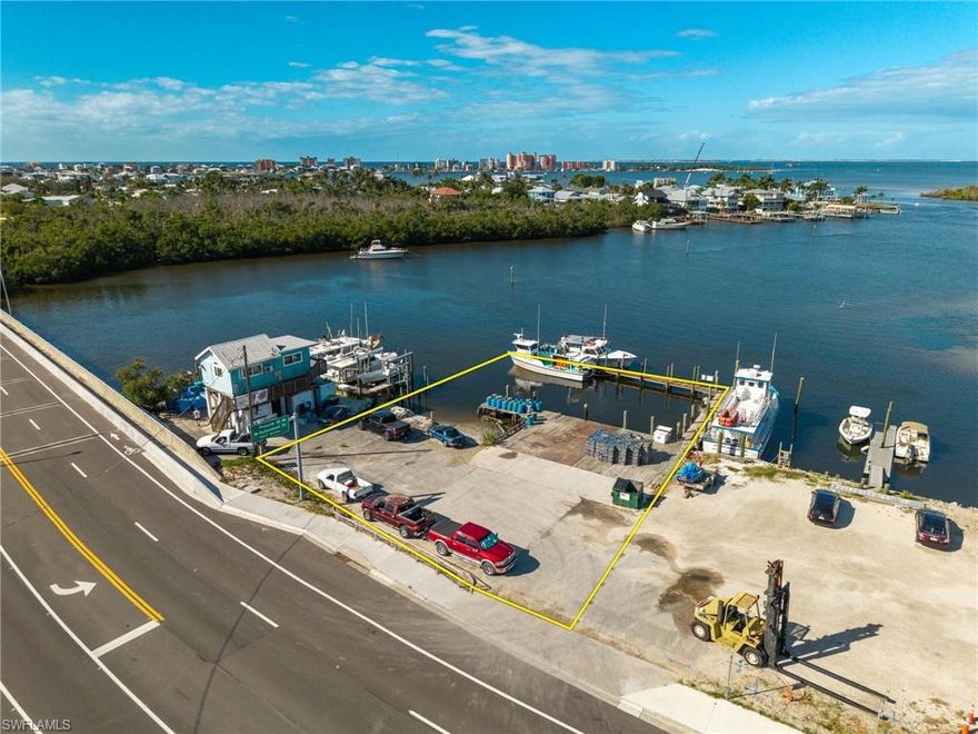 If you’ve been searching for a waterfront commercial property with Gulf access that’s truly close to everything, this is one of those rare opportunities that doesn’t come around often.

Located directly on San Carlos Boulevard, just about a mile from downtown Fort Myers Beach, this bayfront commercial property sits in the heart of Southwest Florida’s most active marine and tourism corridor. This is a location that works for your business every single day, high visibility, constant traffic, and immediate access to open water.

Surrounded by established, successful businesses like fishing charters, boat rentals, parasailing operators, tiki tours, and other marine-based companies, the synergy here is undeniable. This is exactly where customers already are, and where they expect to find waterfront services. Add in the fact that the property is within walking distance to popular restaurants and bars, and you have consistent foot traffic from locals, tourists, and boaters alike.

One of the biggest advantages of this property is that the submerged land is owned, not leased. That’s a major win for any marina-style or waterfront operation, giving you long-term control, flexibility, and security without the uncertainty of state or municipal lease agreements. A large dock is already in place, allowing for immediate use and faster time to operation.

Located in Pelican Bay, this property offers quick, deep-water access with no long idle zones, meaning you can be in the Gulf of America within minutes. It’s an ideal setup for a marina, charter fishing operation, boat tours, eco-tourism business, water taxi, or marine service company or a combination of uses.

This is a true Fort Myers Beach waterfront commercial property with visibility, access, and infrastructure already in place. With ongoing redevelopment and continued growth in the Fort Myers Beach area, properties like this are becoming increasingly rare.

If you’ve been waiting for a bayfront commercial property near Fort Myers Beach with Gulf access, owned submerged land, and a prime San Carlos Blvd location, this is your chance to secure a piece of Southwest Florida’s waterfront future. Opportunities like this don’t last long.
