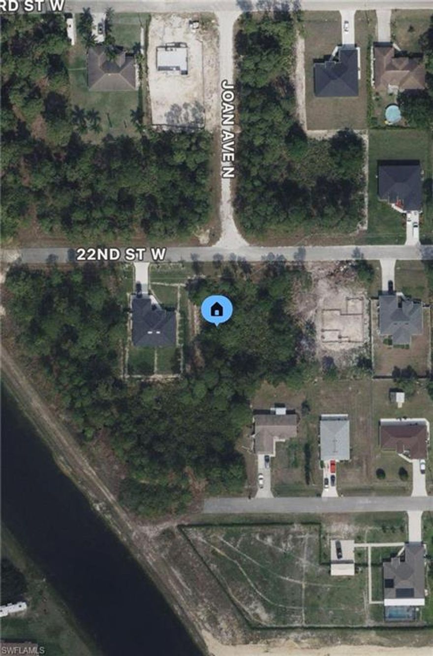 Excellent opportunity next to Lee Blvd. Adjacent to a canal and new construction home! Paved road and electric at the curb.