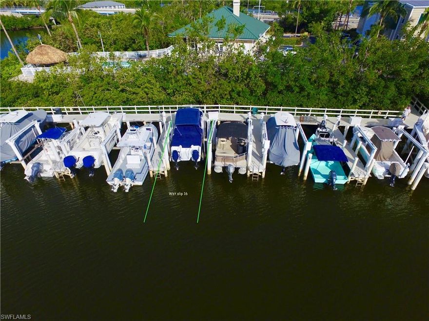 This is a deeded wet boat slip with 14k Boat Lift, Dock Box, Power & Water. Barefoot Boat Club is a conveniently located private marina and club. 90 indoor storage rack minimums with 24 hour security. 15deeded wet slips and stand by slips for mooring dry slip boats. The marina also has a Clubhouse equipped with full catering kitchen, pool, and tiki hut for owners use. Ice is provided as a convenience to owners. Boat service and repair is also available. Exterior boat racks are available outdoors for your own detailing upon request. This marina is located a short 20 minute boat ride to the Gulf Via Wiggins Pass, Little Hickory Pass or New Pass. Association dues are$1045.00 per quarter.