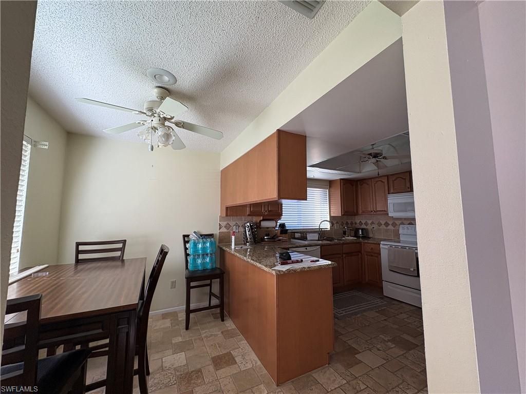 Photo of 7371 Golf Villa DR, FORT MYERS, FL 33967 (MLS # 225084081)