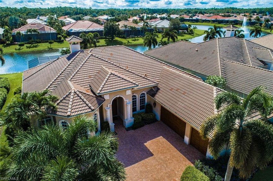 Fabulous custom estate within Hammock Isles in the Vineyards! Enter the double entry into the foyer and look out through the Living Room to the expansive lanai with built in grill/kitchen and a custom pool/spa with a rock waterfall! This magnificent lakefront property boasts a Master suite with a fireplace and his and her bathrooms, three guest bedrooms and a beautiful den with custom built-ins for your home office. The chef’s custom kitchen was especially designed for this home and includes a double oven, cooktop, 48” refrigerator and pantry along with a center island with sous sink. The large family room with wet bar opens up to the lanai with disappearing pocket doors. Built in 2006 this home has been well cared for by its original owners and has just been updated with new carpet, paint & plantation shutters. This home also includes full electric hurricane shutters for the lanai and custom window protection for the front. Owners have the choice to become members of The Vineyards Country Club which has recently been renovated and now offers an award-winning wellness center & Spa along with 36 holes of golf, an updated tennis center, Pickle ball & Bocce courts.