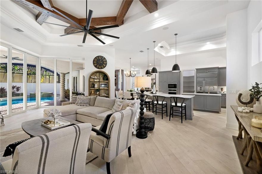 Welcome to 18090 Via Bellamare, a beautifully remodeled fully furnished and decorated estate in the heart of Miromar Lakes. This residence, located across from the beach and lake, offers a perfect blend of luxury & natural beauty. Step inside to an open floor plan with new paint throughout, creating a fresh and modern atmosphere. The kitchen is a chef's dream with top-of-the-line appliances and custom cabinetry. With four bedrooms, including a private cabana guest house, plus a den, there's ample space for family or guests. The master suite offers a spa-like ensuite bath and walk-in closets. The exterior features a large 3 plus car garage and landscaped surroundings. This home is a like-new gem in Miromar Lakes, offering a unique opportunity to experience luxury living. Indulge in unparalleled luxury in Miromar Lakes where the award-winning clubhouse awaits with pristine sandy beaches featuring elegant cabanas, water sports, tennis courts, golf, a state-of-the-art fitness center, waterfront dining, an art theater, a rejuvenating spa, and top-tier concierge services. Step into the pinnacle of opulence and experience a lifestyle like no other.