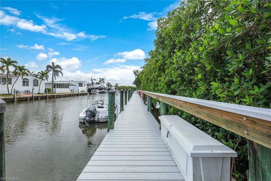 Look No More!  DEEDED BOAT DOCK INCLUDED!  This tidy extra-wide (100 sq. ft.) condo features a remastered kitchen to include newer cabinetry, granite, and newer stainless appliances.  Solid-surface flooring throughout to include bamboo in the bedrooms and tile throughout the living areas.  Plantation Shutter throughout.  Turn-key furnished.  Direct Gulf Access via Haldeman Creek.  The condo enjoys southern exposure overlooking a sunny slashpine preserve and the clubhouse pool.  Naples Sandpiper Bay Club offers 2 pools, docks upon availability (purchase or lease), outdoor grilling areas and a social clubhouse.  It’s minutes from the Naples Pickleball Center (home of the US Pickleball Open) and the world-famous Naples Botanical Garden.  Minutes from the boutique shopping & gourmet shopping of 5th Avenue So. and the renown beaches along the Gulf of Mexico, you can’t beat this location for the money.   …and The Sunsets are Free!