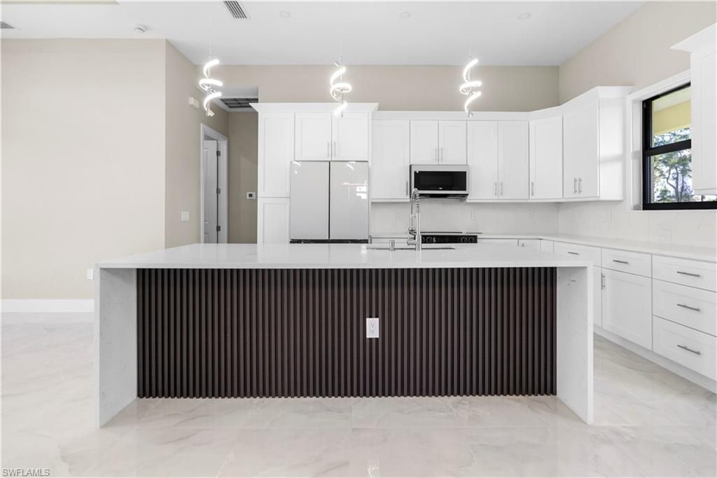 Photo of 2815 19TH ST SW, LEHIGH ACRES, FL 33976 (MLS # 226013730)