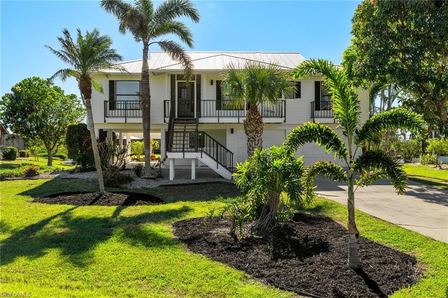 Welcome to your sensational slice of paradise! This stunning Island pool home offers 3 bedrooms, 3 bathrooms and the perfect blend of luxury, comfort, and the natural beauty of Florida living, where every day feels like a vacation. Nestled in a serene location of Bokeelia with modern charm and updates to the kitchen, bathrooms and  screened porch. New metal roof, new vinyl siding, 2 New AC units, fresh exterior stairwells and pool deck and more features inside. Spacious sunrooms invite the Florida sunshine throughout with sparkling water views and the perfect setting for morning coffee and evening relaxation. A big living room with dining area leads to the kitchen with a cook top island, fresh counter tops, a pantry, and lots of cabinets for storage. The laundry room is conveniently located off the kitchen while a sunny nook is ideal for a den or additional dining area. Split bedrooms for optimal privacy where the large primary bedroom features a lovely sunroom and beautiful views plus modern updates to the bathroom and a dressing area with 2 walk in closets. The guest rooms have great closet storage and share a bathroom with a large shower. Downstairs has a home gym with a full bathroom to serve poolside guests. You will absolutely love the screened porch with room to lounge, dine or nap in a hammock while enjoying the amazing Florida breezes. The two car garage has a freshly painted floor and room for storage plus a lower level concrete pad that could be used for more outdoor living or park your golf cart! Take a dip in the Southern facing pool for maximum sun exposure, and savor your surroundings with beautiful Florida landscape and wildlife. This home is designed for enjoyment and a great vacation rental as well. Being sold Turnkey so you can start enjoying the island lifestyle right away. Come take a look and grab this deal!