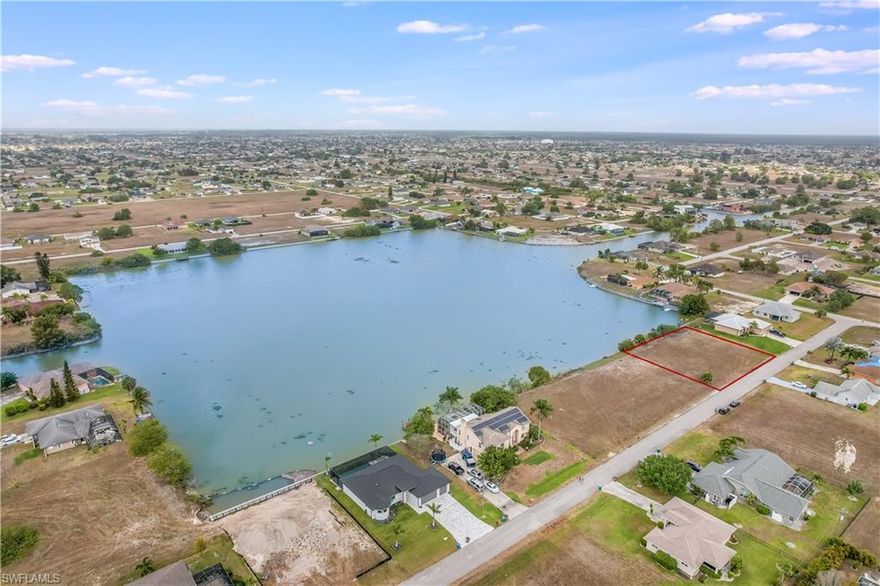 Sunset Dream Lot on Holiday Lake in Cape Coral!! The Sellers combined two standard lots to create this rare and amazing west-facing lot of nearly a half acre of land. Build your expansive dream home with plenty of privacy and elbow room. Enjoy breathtaking sunsets over the lake from your lanai and pool. Or hop in your boat and enjoy a day of fishing for Bass, Blue Gills, Catfish, and Gar, or simply exploring the 23 miles of canals and nine lakes. Located in a quiet neighborhood but close to Pine Island Road and area amenities, shopping, dining and entertainment. Go by and see it today!