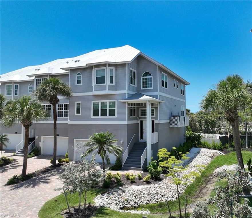 This beautiful beach style 3 story villa home is located in the Villas at Barefoot Beach and within the beautiful gated community of Barefoot Beach. The home offers the best in Florida beach lifestyle including: just a few steps to the white sands of Barefoot Beach via the private beach boardwalk for Villas at Barefoot Beach residents, the ability to rent a dock within the community for your boat or jets skis for quick access to the Gulf of Mexico with no bridges, and the enjoyment of one of two tropical swimming pools and a spa right out your door to the right and left of the Villa. With 4162 SQ Ft of entertaining and living space, 2654 AC space, a spacious open floor pan, volume ceilings, the natural light throughout that can only be achieved with an end unit, 3 bedrooms, 3 baths, plus a den, master suite with oversized walk in closet & large master bath, a 3 car garage, impact windows and doors, metal roof - this home has it all. This is an HOA community, you own the ground under the Villa, and is the best option for lock and go living. Turnkey furniture & furnishings are negotiable. Barefoot Beach is one of Collier County’s finest gated beach communities and provides 24 hour guard patrols, one of the highest ranked beaches in the country and simply an amazing place to live. Option to join the Club at Barefoot Beach (located within the community) which offers casual and fine dining restaurants, pool & beachside food, drinks and chair service, indoor & outdoor bars, tennis courts with pro & a full events calendar. (waitlist with limited usage during wait period). Villas at Barefoot Beach is centrally located to dining, entertainment, golfing, arenas in Naples and Bonita Springs and is close RSW Airport, the Promenade, Coconut Point, Mercato & Waterside Shops and Old Naples. If you are looking for an immaculate move in ready condition beach home that needs no work in Barefoot Beach - this is it.